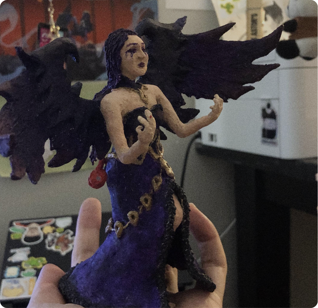 3D pen sculpture of Morgana from League of Legends. A purple haird magical woman.