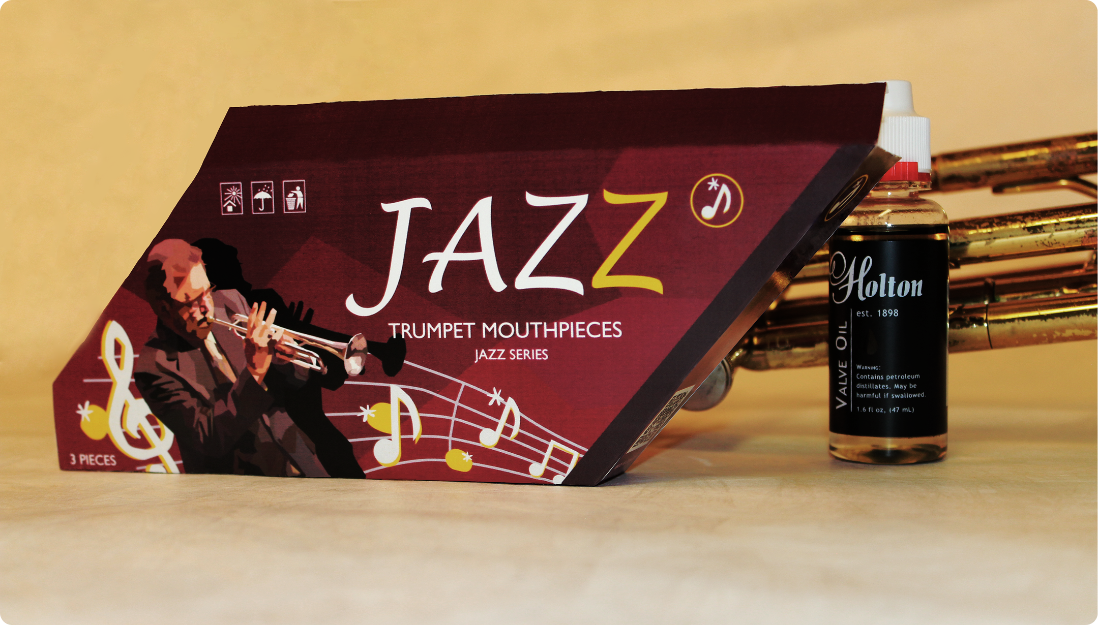 Red toned cardboard with yellow highlights and sharp shaped packaging for Jazz trumpet mouthpieces.