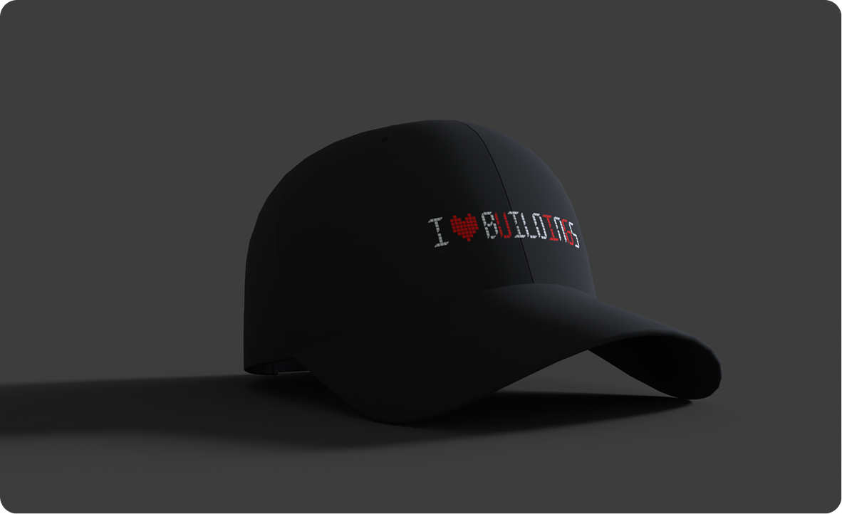 Black baseball cap with pixel-style text reading “I ♥ BUILDING.”